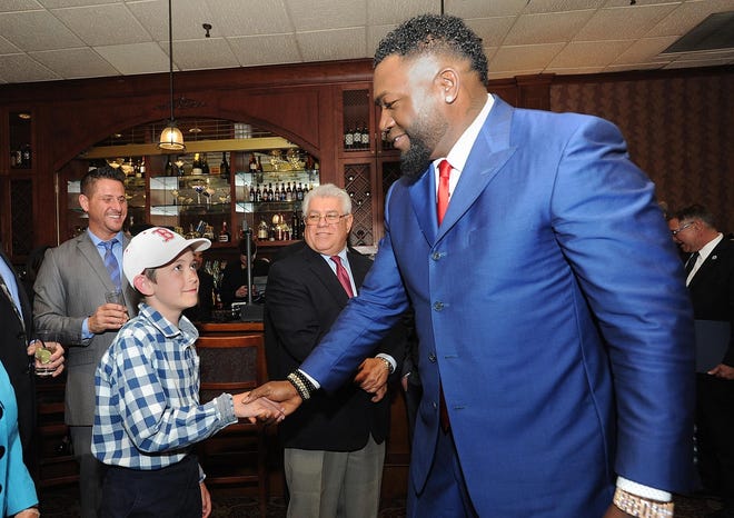 Nine-year-old Chase Menard Preble shakes hands with Red Sox legend David Ortiz at a meet and greet in 2017 at the Venus de Milo before a UMass fundraiser. [Herald News file photo]