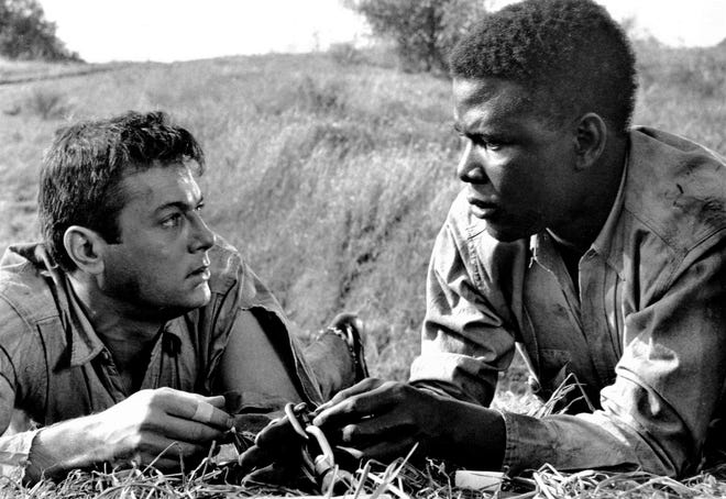 Tony Curtis and Sidney Poitier in “The Defiant Ones” (1958). [Curtleigh Productions]