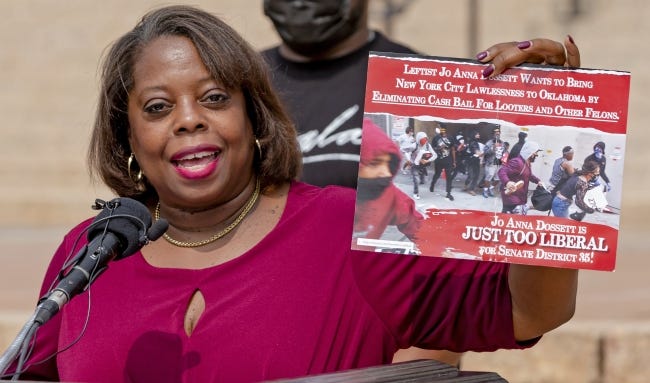Alicia Andrews, Oklahoma Democratic Party chairwoman, holds up a mailer targeting a Democratic legislative candidate at the Oklahoma state Capitol in Oklahoma City, Okla. on Wednesday, Sept. 30, 2020. [Chris Landsberger/The Oklahoman]