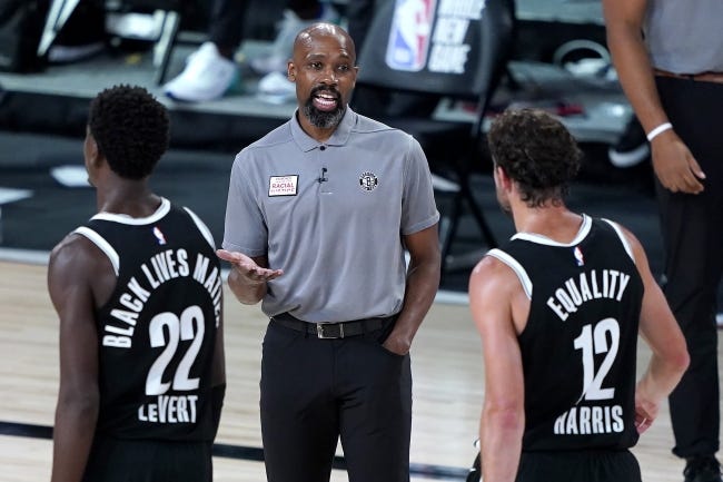Former Brooklyn Nets interim head coach Jacque Vaughn (middle) was a four-year starter for the Jayhawks from 1993-97. [AP Photo/Ashley Landis, Pool]