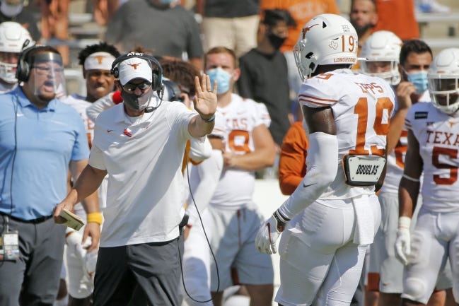 Texas head coach Tom Herman gives instructions to Texas tight end Malcolm Epps (19) during overtime of a 53-45 loss to Oklahoma in four overtimes Saturday in Dallas. [AP Photo/Michael Ainsworth]