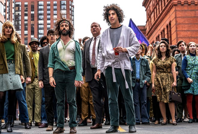 Jerry Rubin (Jeremy Strong), Dave Dellinger (John Carroll Lynch), and Abbie Hoffman (Sacha Baron Cohen) get ready to lead protestors through Chicago. [Netflix]