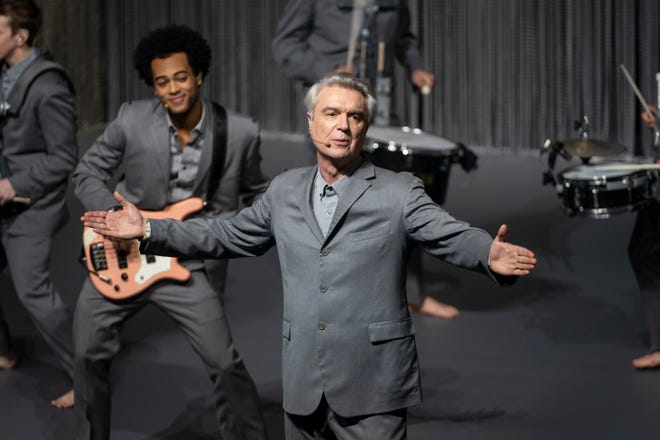 David Byrne fronts his barefooted cast of musicians. [HBO]