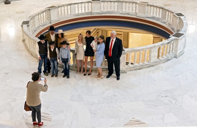 Family members pose for photos Monday during the swearing-in ceremony for new and reelected Oklahoma senators. [Chris Landsberger/The Oklahoman]