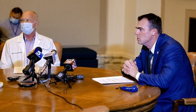 Governor Kevin Stitt and Commissioner of Health Lance Frye answer questions regarding COVID-19 during a press conference at the Oklahoma state Capitol in Oklahoma City on Thursday. [Chris Landsberger/The Oklahoman]