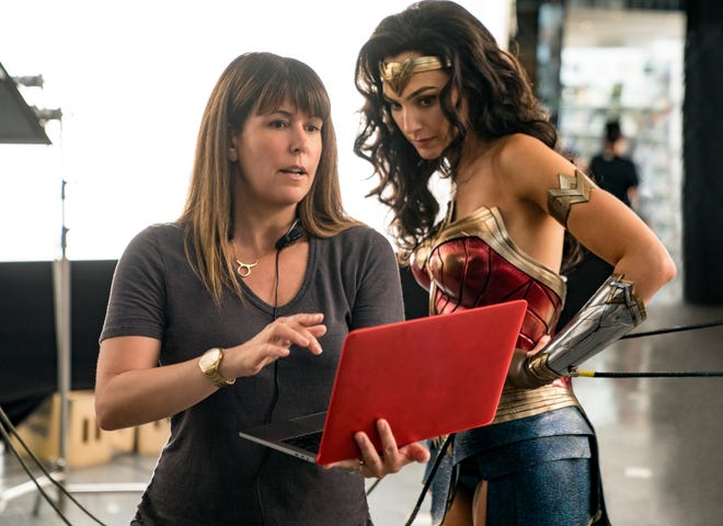 Director Patty Jenkins discusses a scene with Gal Gadot. [Warner Bros.]