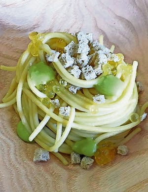 Kamut Spaghetti with fir pesto, Arctic Char roe, and Hay Bread. [Courtesy of Monogramo Felicetti]