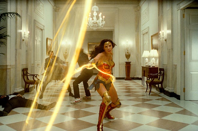 Wonder Woman (Gal Gadot) practices some ropin’ in a White House corridor. [Warner Bros.]