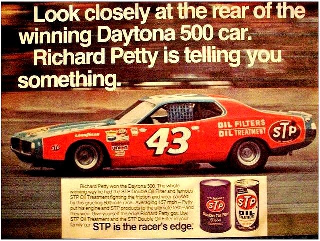 Andy Granatelli’s STP sponsorship of Richard Petty that began in 1972 could well be Granatelli’s most famous auto racing and consumer branding effort. However, his winning the Indy 500 with Mario Andretti in 1969 is his most famous single achievement thanks to the victory lane kiss photo that went worldwide. [STP]