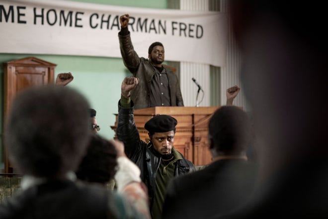 Fred Hampton (Daniel Kaluuya) spreads the word from the dais as Bill O’Neal (LaKeith Stanfield) shows his support. [Warner Bros. Pictures]