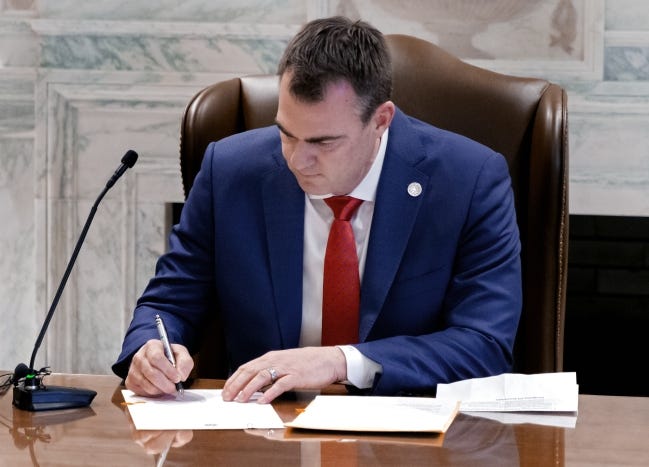 Gov. Kevin Stitt issued an executive order Wednesday in an attempt to reduce wait times for Oklahomans seeking a driver's license appointment. Stitt is pictured signing legislation at the Oklahoma state Capitol in Oklahoma City, Okla. on Wednesday, Feb. 10, 2021. Bill 1031 will temporarily allow public bodies to meet virtually during the COVID-19 pandemic. [Chris Landsberger/The Oklahoman]