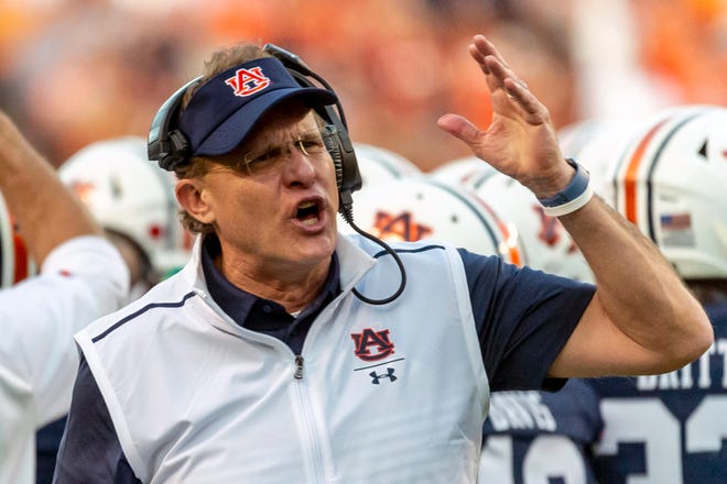 FILE - Auburn head coach Gus Malzahn argues a call during the first half of an NCAA college football game against Alabama in Auburn, Ala., in this Saturday, Nov. 30, 2019, file photo. Central Florida hired Gus Malzahn as its football coach Monday, Feb. 15, 2021, a little more than two months after he was fired by Auburn.(AP Photo/Vasha Hunt, File)