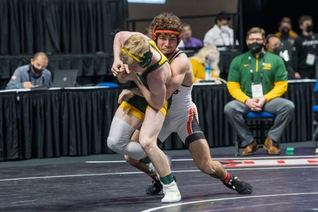 Oklahoma State's Daton Fix, right, wrestles against Kellyn March of North Dakota State on Saturday in the opening round of the Big 12 wrestling championships at the BOK Center in Tulsa. [Photo provided by the Big 12 Conference]
