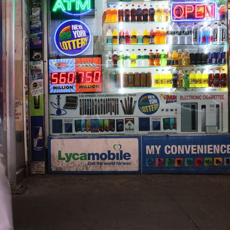 A Powerball and Mega Millions lottery advertisement is displayed at a convenience store on July 12 in New York City.
