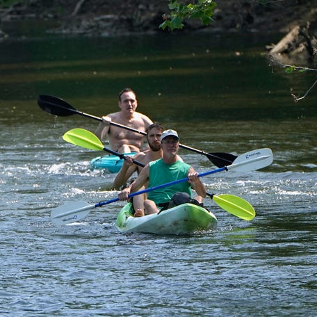 Kayakers paddle in Cuyahoga Valley National Park on June 2, 2023.
