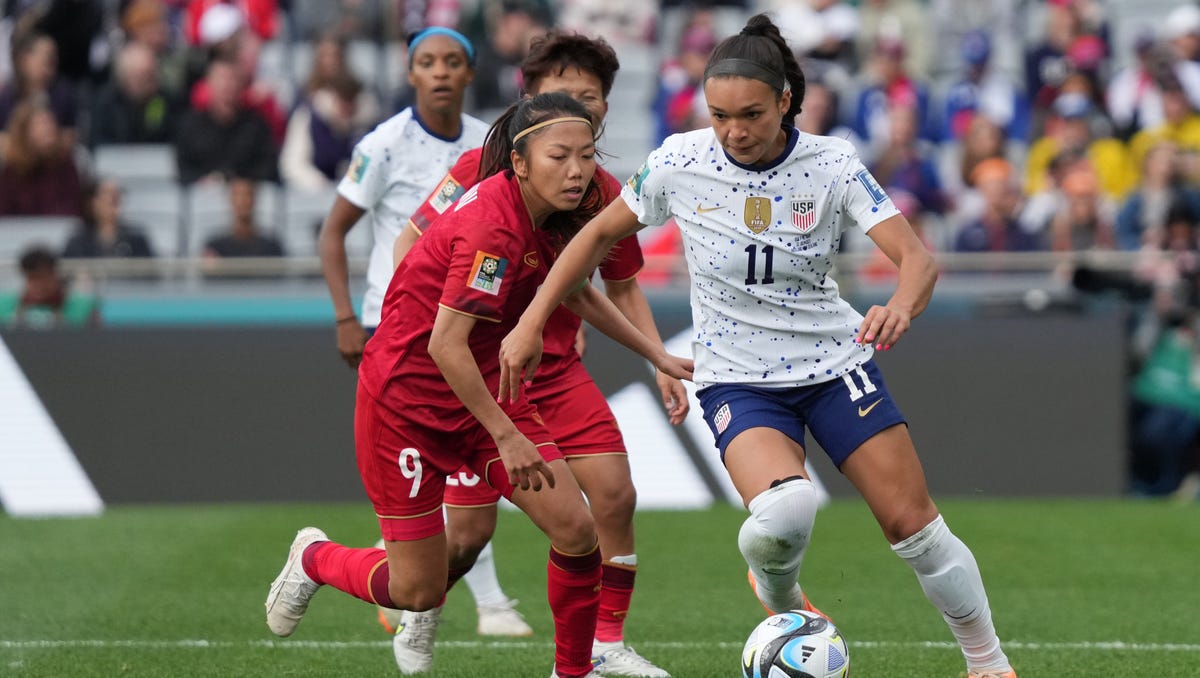 Forward Sophia Smith (11) moves the ball past Vietnam forward Huynh Nhu (9) during the U.S. Women's National Team's opener at the 2023 World Cup at Eden Park in New Zealand.