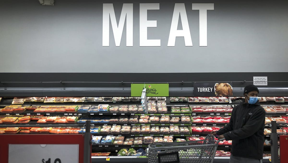 A man shops in the meat section at a grocery store, April 28, 2020 Washington, DC.
