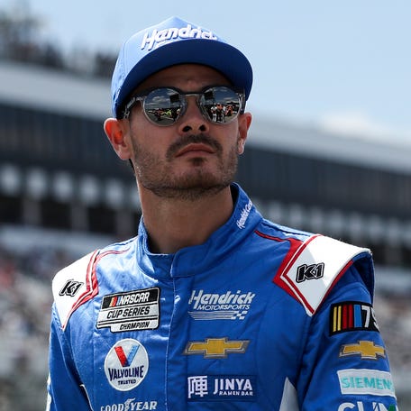 Kyle Larson, walking on pit road at Pocono Raceway, was furious with winner Denny Hamlin after Sunday's race.
