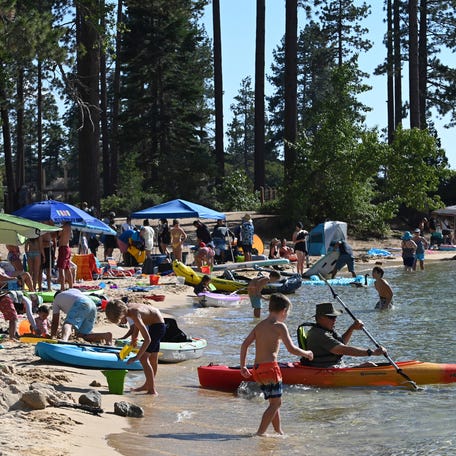 Sand Harbor is packed with visitors at Lake Tahoe Nevada State Park in Incline Village, Nevada on July 17, 2023.