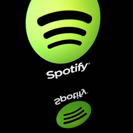 In this file photo illustration taken on April 19, 2018 shows the logo of online streaming music service Spotify displayed on a tablet screen in Paris. (Photo by Lionel BONAVENTURE / AFP)