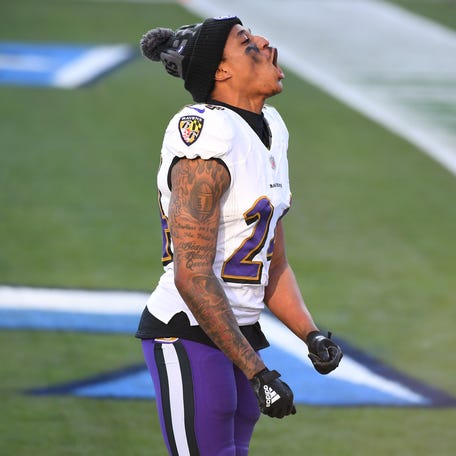 Former Baltimore Ravens cornerback Marcus Peters celebrates after the AFC Wild Card playoff game win against the Tennessee Titans in 2021.