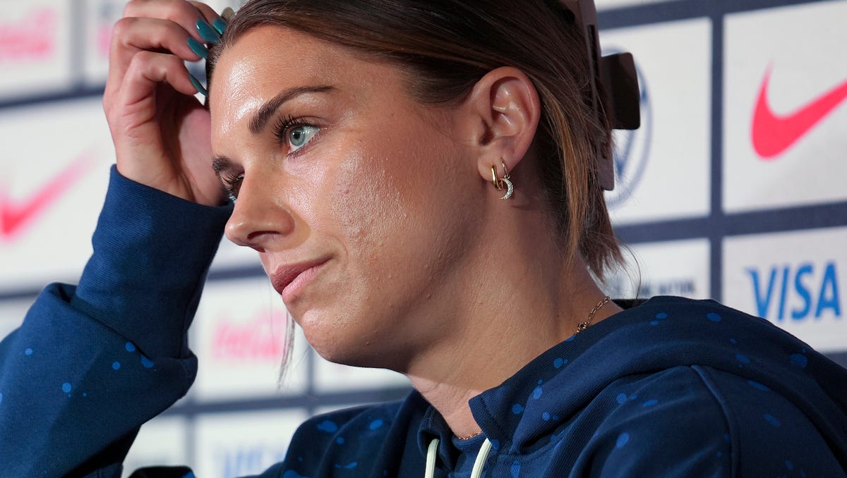 U.S. forward Alex Morgan answers questions during a news conference.