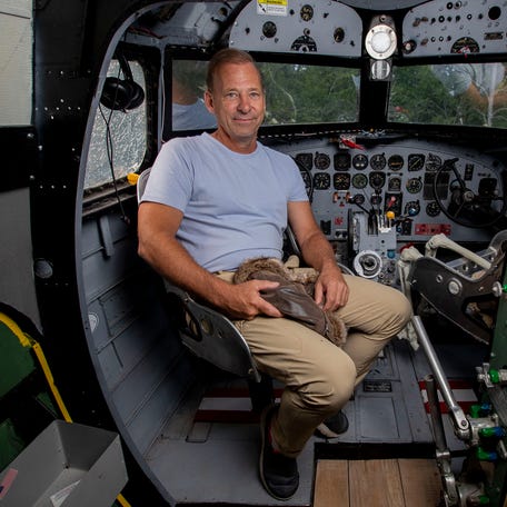 Joe Draeger poses for a portrait in the cockpit of a 1941 DC-3 cargo plane on Wednesday, August 9, 2023, north of Antigo, Wis. Draeger repurposed the plane to house an Airbnb.  Tork Mason/USA TODAY NETWORK-Wisconsin