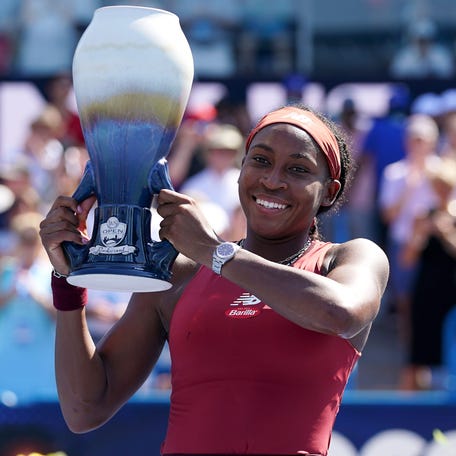 Coco Gauff raises the Rookwood Cup after defeating Karolina Muchova in the women's singles final of the Western & Southern Open on Sunday.