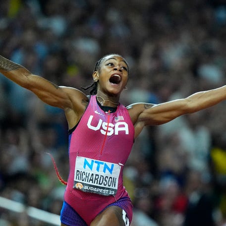 Sha'Carri Richardson, of the United States, celebrates after winning the gold medal in the final of the women's 100-meters during the World Athletics Championships in Budapest, Hungary, on Aug. 21, 2023.