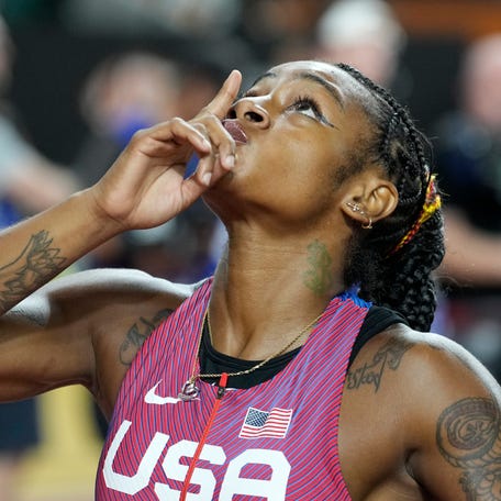 Sha'Carri Richardson, of the United States, reacts after crossing the finish line to win the gold medal in the women's 100-meter final during the World Athletics Championships in Budapest, Hungary, Aug. 21, 2023.