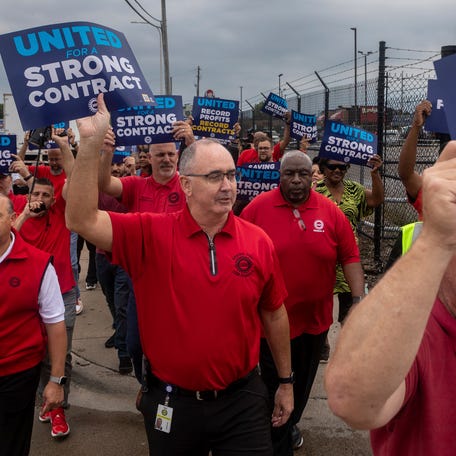 UAW President Shawn Fain walks alongside other union members during a rally and practice picket near the Detroit Assembly Complex - Mack in Detroit on Wednesday, Aug. 23, 2023.