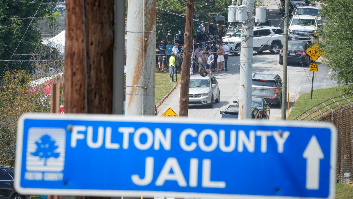 Media gather as Rudy Giuliani after he surrendered in Atlanta to be booked as part of county prosecutors' investigation into efforts to overturn the 2020 election in Georgia at the Fulton County Jail Intake Center in Atlanta, GA.