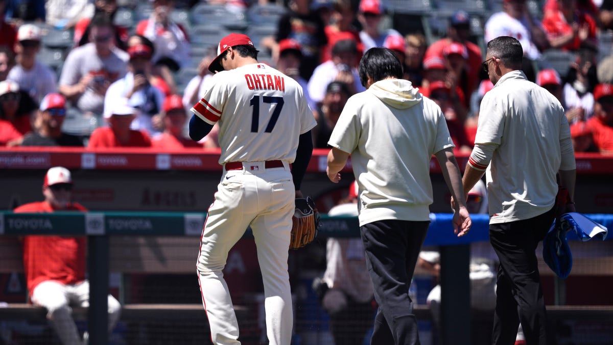 Angels starting pitcher Shohei Ohtani is removed from the game after an apparent injury.