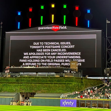 A message on the main scoreboard at Guaranteed Rate Field announces the cancellation of Friday's postgame concert in Chicago.