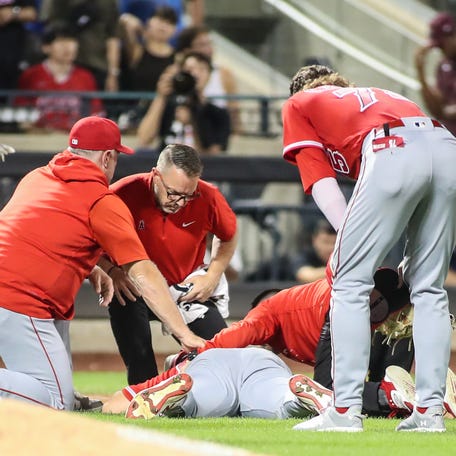 Aug 26, 2023; New York City, New York, USA; Los Angeles Angels starting pitcher Chase Silseth (63) lays on the ground after getting hit in the head by a throw in the fourth inning against the New York Mets at Citi Field. Mandatory Credit: Wendell Cruz-USA TODAY Sports