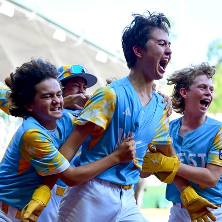 El Segundo (California) third baseman Louis Lappe (19) celebrates with teammates after hitting a walk-off home run to beat Curacao and win the Little League World Series.