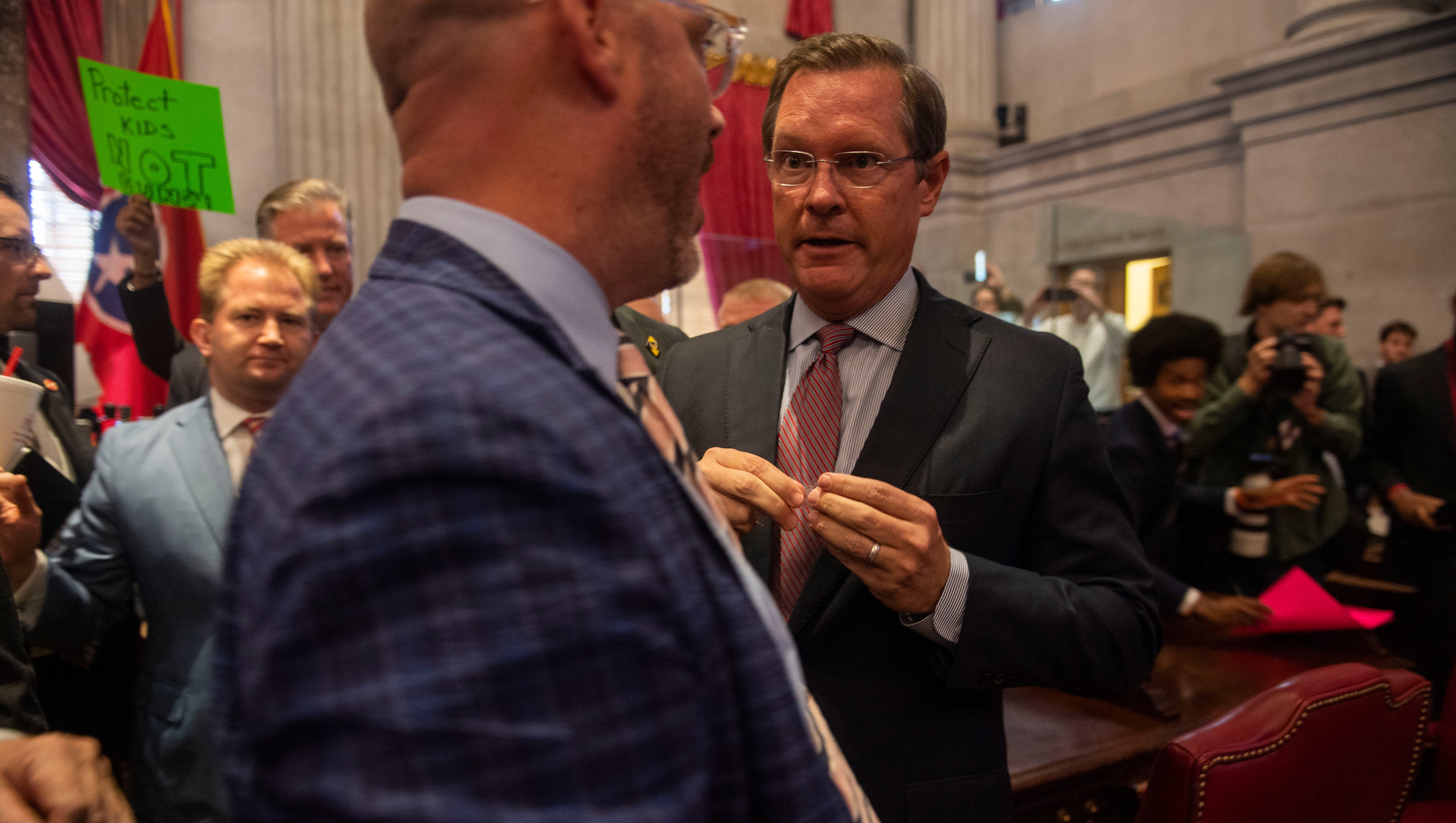 Rep. Johnny Garrett, R-Goodlettsville, tries to calm down Speaker Cameron Sexton after tempers flared on the House floor following the special legislative session on public safety in Nashville, Tenn., on Tuesday, August 29, 2023.