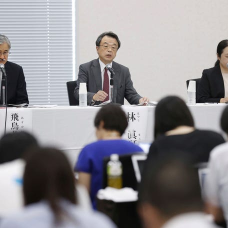Lawyer and former prosecutor Makoto Hayashi, center, speaks during a news conference in Tokyo Tuesday, Aug. 29, 2023. The investigative team set up by a powerful Japanese boys-band agency at the center of sexual abuse allegations recommended Tuesday the chief executive resign to take responsibility. Hayashi who heads the investigation, said the team is also recommending financial compensation for those who have, and will, come forward.