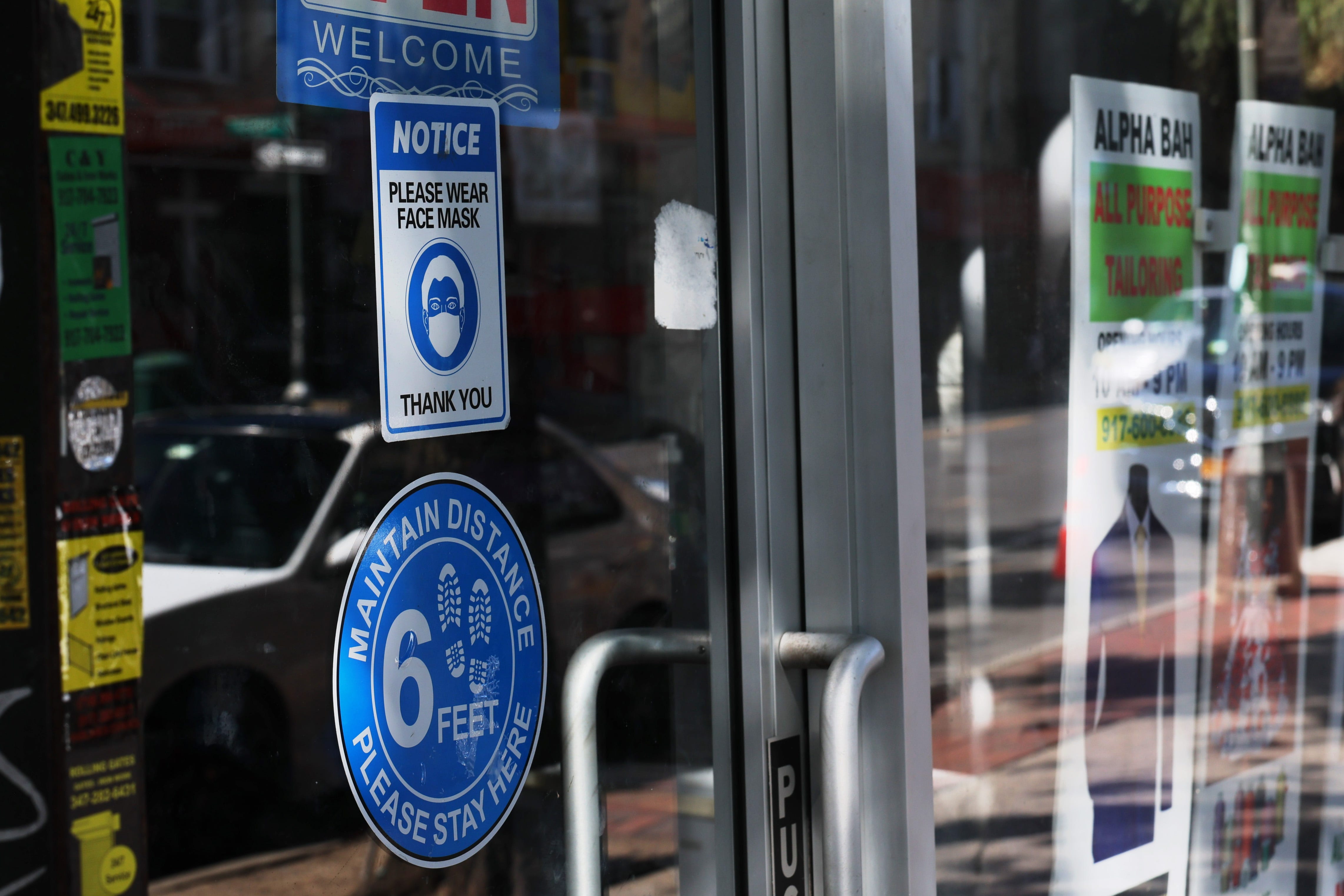 NEW YORK, NEW YORK: A mask-required sign is seen on a door of a store on Sept. 01, 2023 in the Flatbush neighborhood of Brooklyn borough in New York City. A spike in late-summer COVID-19 positive cases in the U.S. has some schools, hospitals, and businesses encouraging and at times requiring people to start masking up again. (Photo by Michael M. Santiago/Getty Images) ORG XMIT: 776026644 ORIG FILE ID: 1653156891