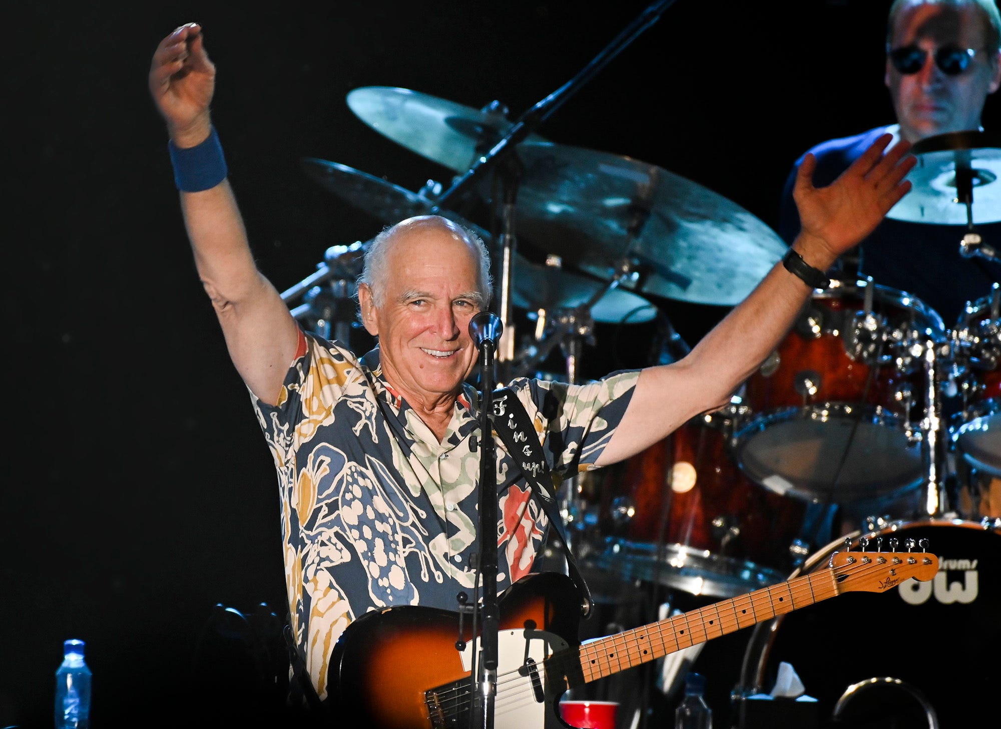 Jimmy Buffett thanks the capacity crowd at the Coffee Butler Amphitheater on Feb. 9, 2023, during a string of four shows in Key West, Fla. Buffett, who popularized beach bum soft rock with the escapist Caribbean-flavored song 