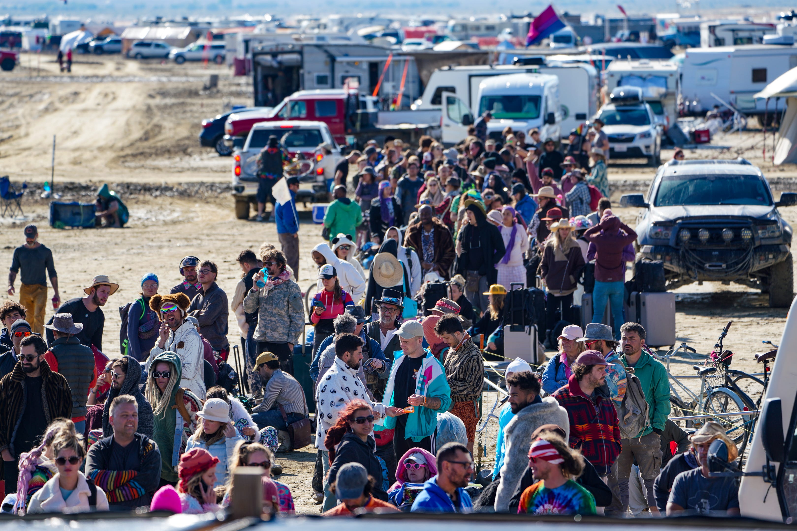 Hundreds of Burning Man attendees who planned to leave on buses wait for information about when they will be able to leave on Labor Day.