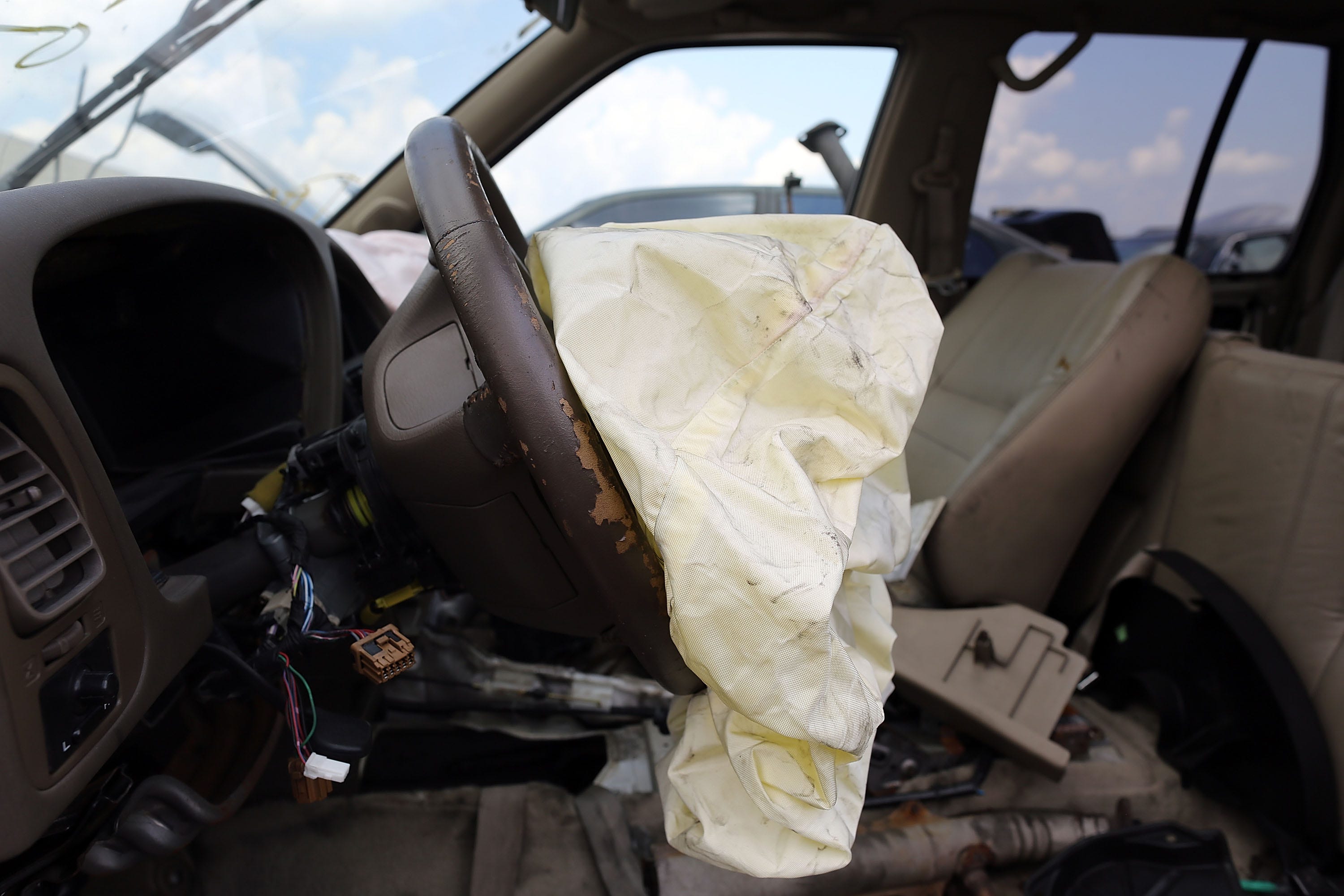 MEDLEY, FL - MAY 22: A deployed airbag is seen in a Nissan vehicle at the LKQ Pick Your Part salvage yard on May 22, 2015 in Medley, Florida. The largest automotive recall in history centers around the defective Takata Corp. air bags that are found in millions of vehicles that are manufactured by BMW, Chrysler, Daimler Trucks, Ford, General Motors, Honda, Mazda, Mitsubishi, Nissan, Subaru and Toyota. (Photo by Joe Raedle/Getty Images) ORG XMIT: 555793609 ORIG FILE   ID: 474401448