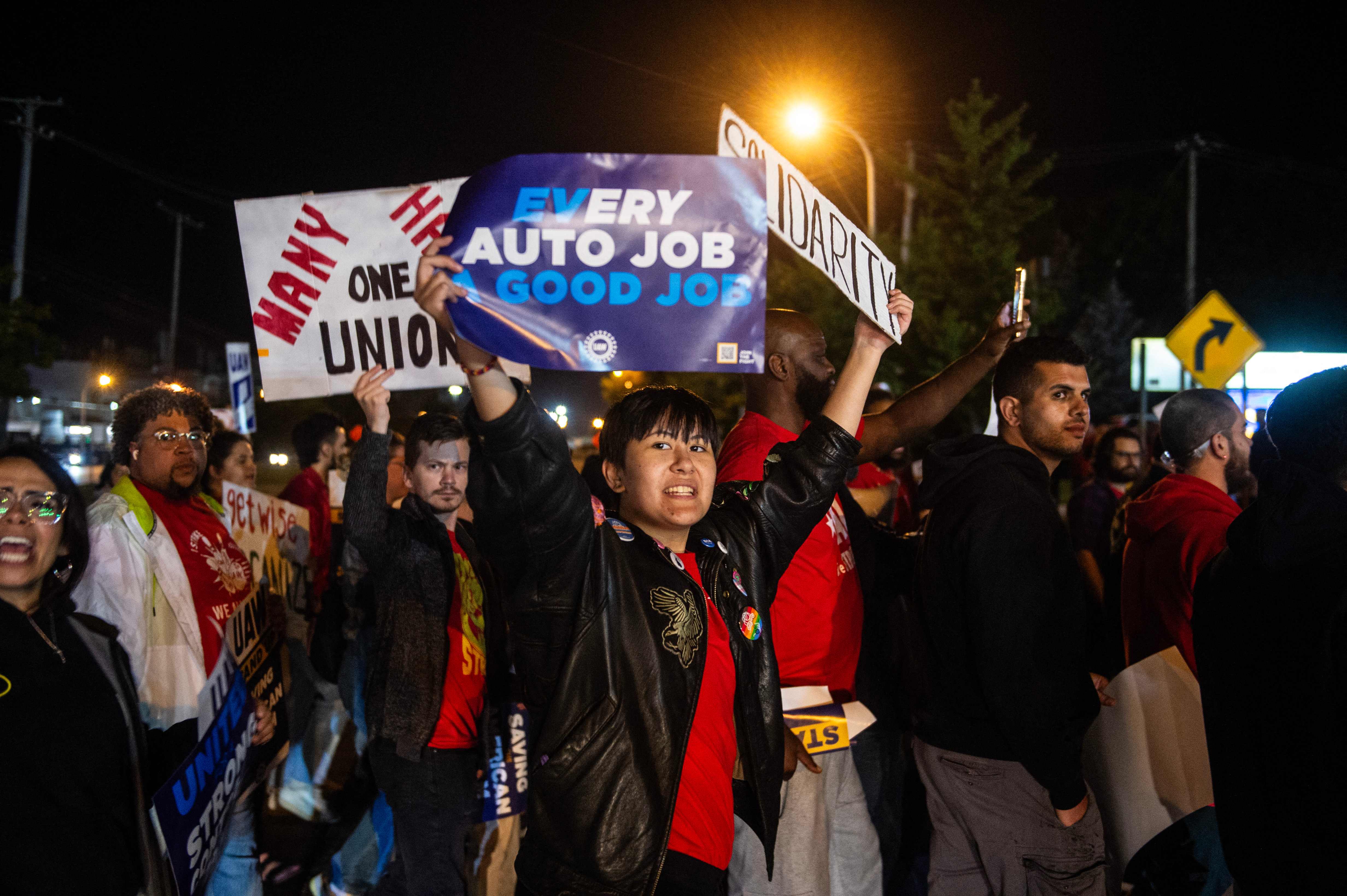 Members of the UAW (United Auto Workers) picket and hold signs outside of the UAW Local 900 headquarters across the street from the Ford Assembly Plant in Wayne, Michigan, on Sept. 15, 2023. The US auto workers' union announced the start of a strike at three factories just after midnight on Friday, September 15, as a deadline expired to reach a deal with employers on a new contract.    "Tonight, for the first time in our history, we will strike all three of the Big Three at once," UAW President Shawn Fain said in a webcast two hours before the midnight contract expiration at the three major automakers.
