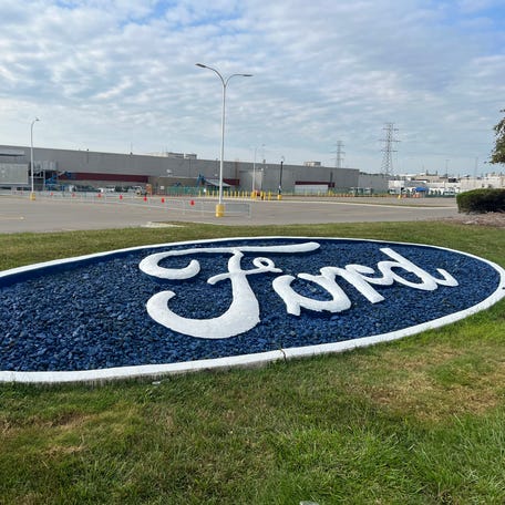 A Ford logo decorates the grass outside the Michigan Assembly Plant in Wayne on Sunday, Sept. 17, 2023. UAW workers are on strike at the factory as part of a national strategy.