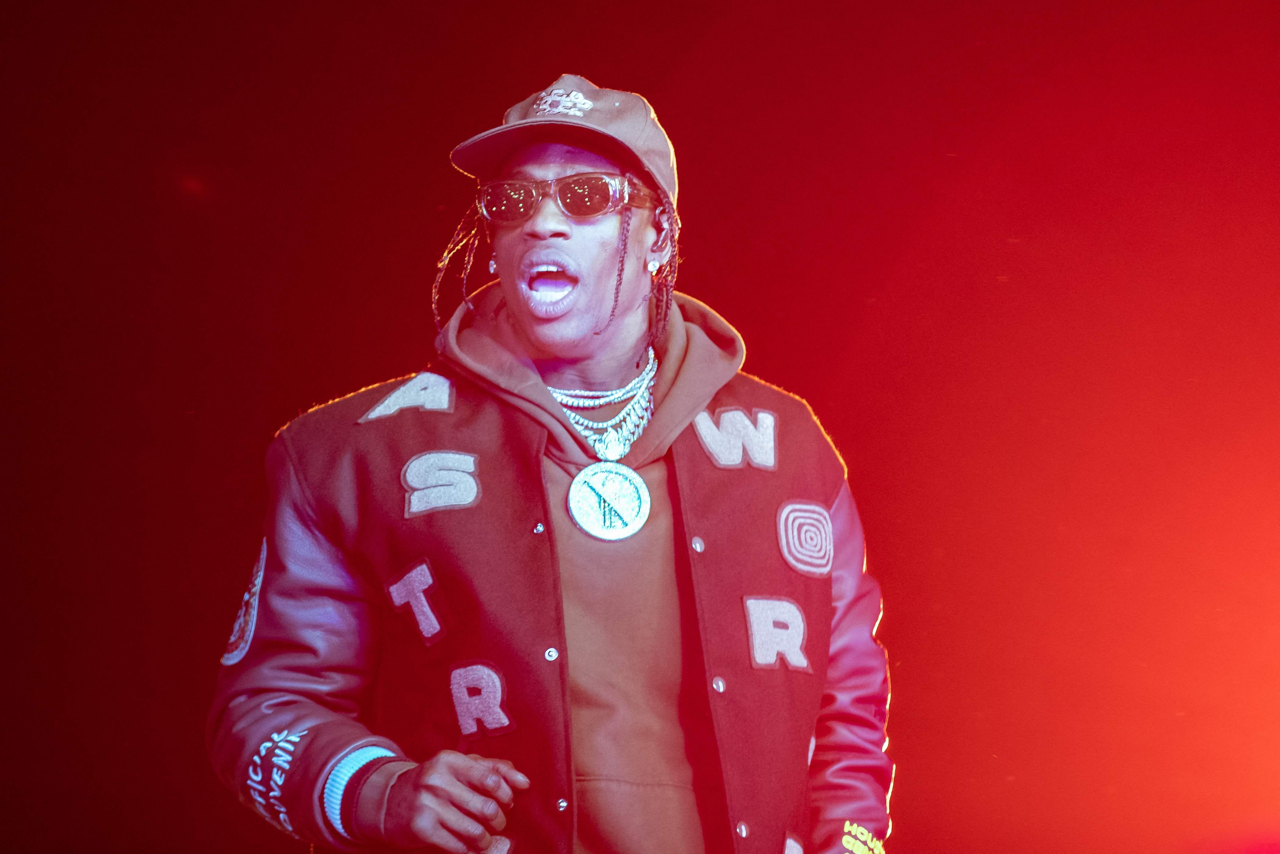 (FILES) Travis Scott performs during the Astroworld Festival at NRG Stadium on November 9, 2019 in Houston, Texas. US rapper Travis Scott will not face criminal charges for the crowd movement that left ten people dead at the Astroworld festival he co-organized in Texas in November 2021, judicial authorities announced on June 29.    "No criminal charges will be filed," Harris County District Attorney Kim Ogg's office said in a statement. (Photo by SUZANNE CORDEIRO / AFP) (Photo by SUZANNE CORDEIRO/AFP via Getty Images) ORIG FILE ID: AFP_33LJ2NM.jpg