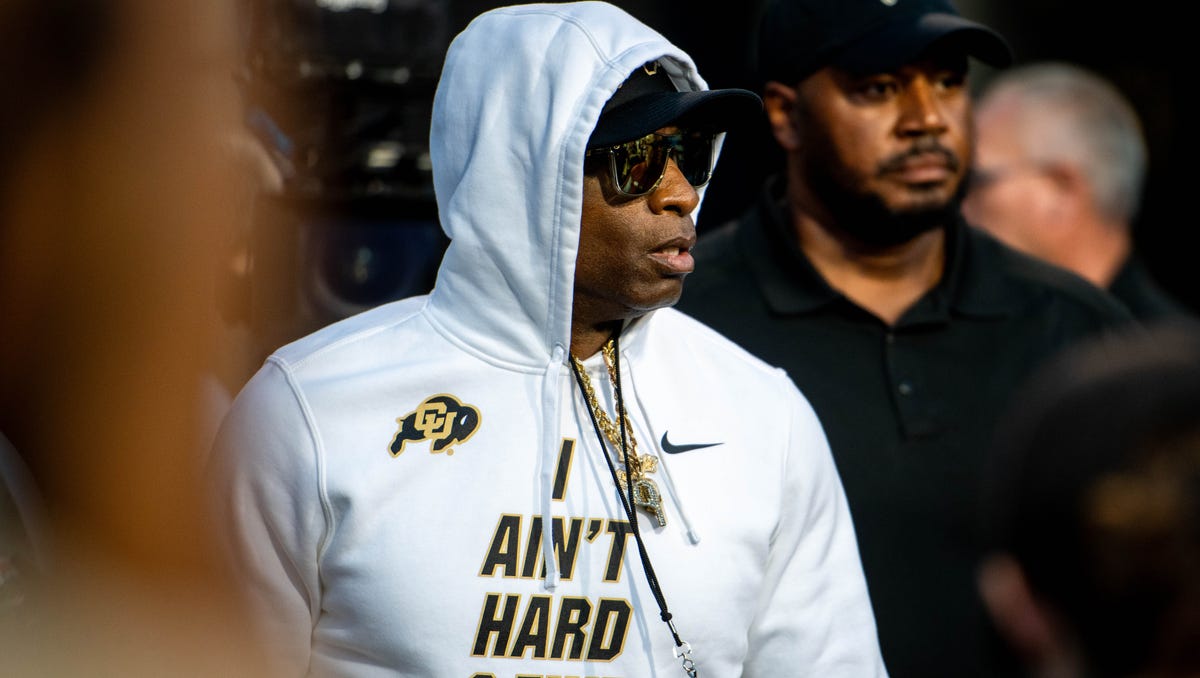 Deion Sanders comes out of the locker room before Colorado's win over Colorado State.