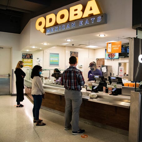 Customers give their orders at Qdoba in the Student Union at the University of Tennessee in Knoxville, Tenn., on Monday, Sept. 22, 2020.
