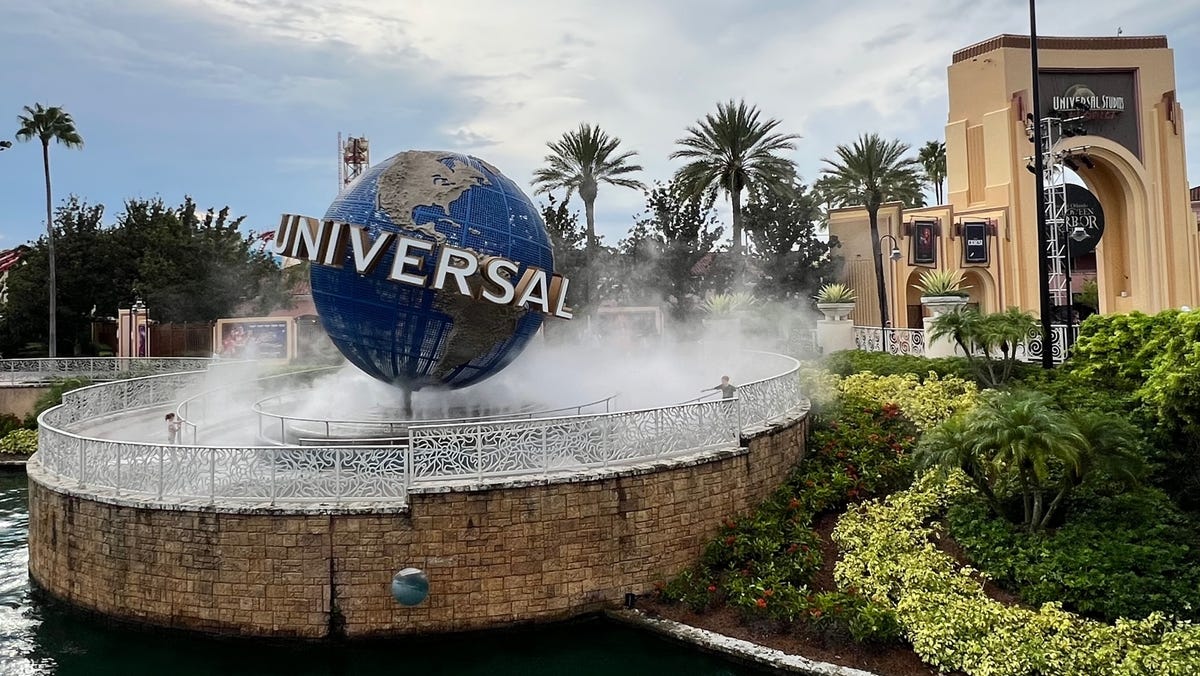 Mist rises up around Universal Orlando Resort's iconic globe.