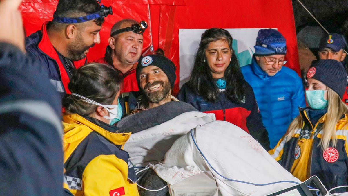 American researcher Mark Dickey, center, talks to journalists after being pulled out of Morca cave near Anamur, south Turkey, on early Tuesday, Sept. 12, 2023, more than a week after he became seriously ill 1,000 meters (more than 3,000 feet) below its entrance. Teams from across Europe had rushed to Morca cave in southern Turkey's Taurus Mountains to aid Dickey, a 40-year-old experienced caver who became seriously ill on Sept. 2 with stomach   bleeding.