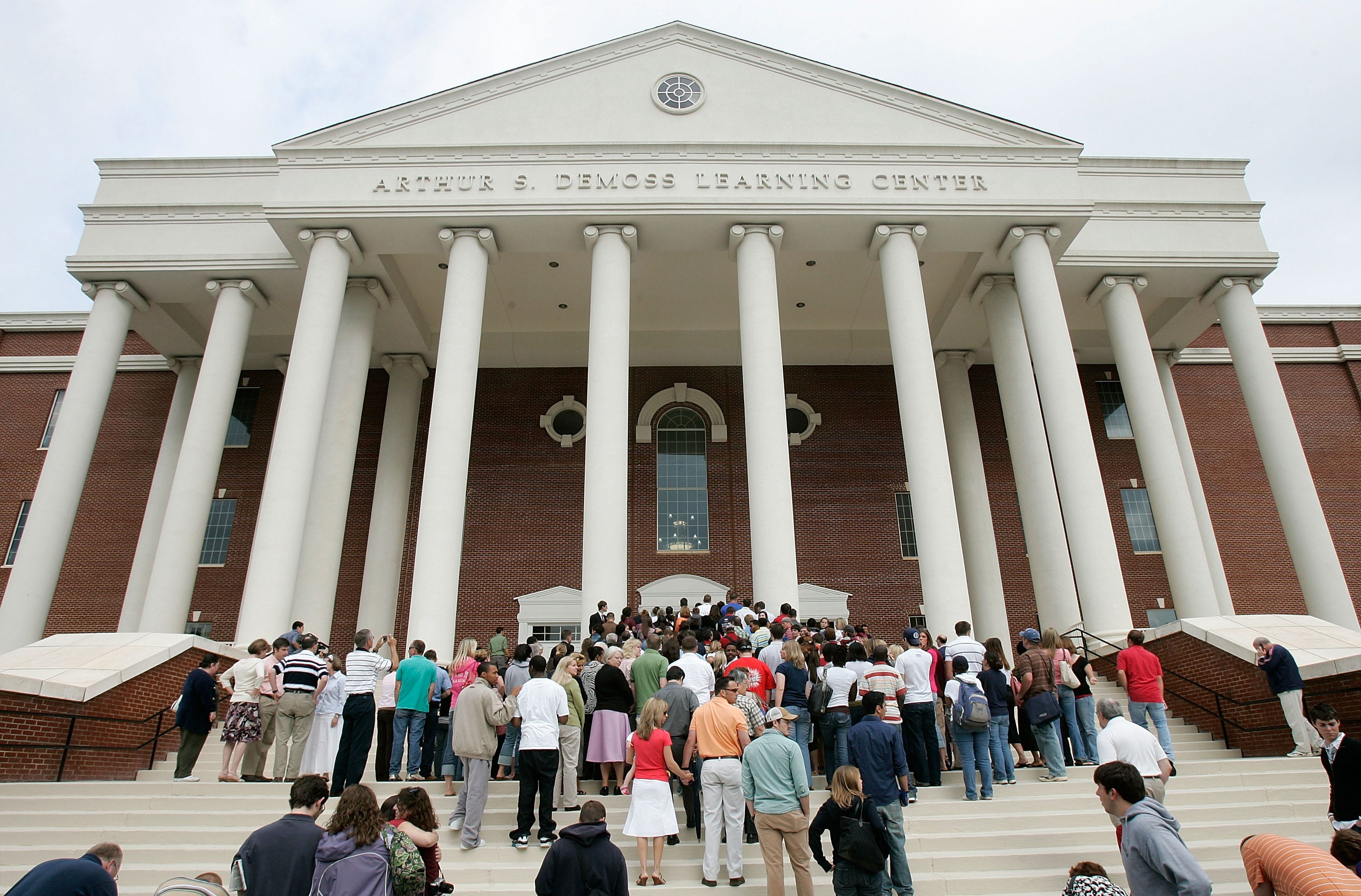 LYNCHBURG, VA - MAY 17: Mourners wait to get into Arthur S. DeMoss Learning Center of Liberty University to pay respects to the late Rev. Jerry Falwell at a viewing May 17, 2007 in Lynchburg, Virginia. Falwell, founder of Thomas Road Baptist Church and Liberty University, died at the age of 73. The funeral service for Falwell is scheduled on May 22 at Thomas Road Baptist Church. (Photo by Alex Wong/Getty Images)
